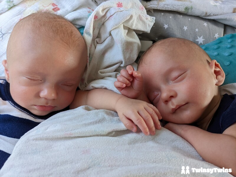 Dual Feeds Newborn Twins Sleeping Side By Side In Moms Lap Muslin Blanket Twin Z Pillow After Breastfeeding